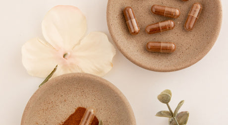 Double Wood Supplements on a plate next to flowers